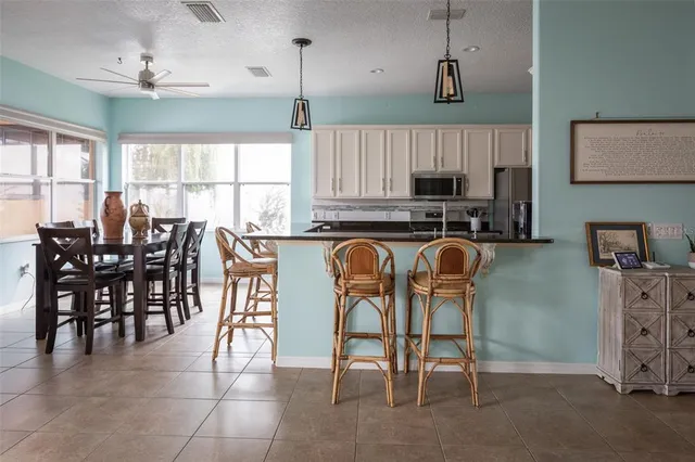 a dining room with furniture and wooden floor