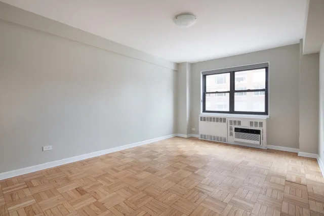 a bedroom with a large bed and a couch