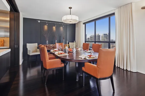 a kitchen with kitchen island a counter top space a sink stainless steel appliances and cabinets
