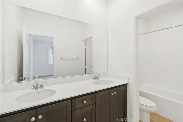 an empty room with a empty space and windows