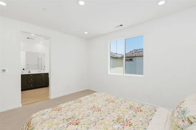 a spacious bathroom with a tub sink shower and mirror