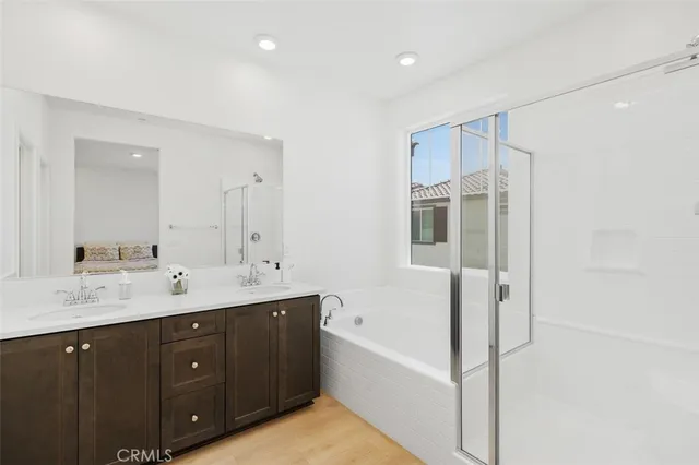 a bathroom with a bathtub and a shower