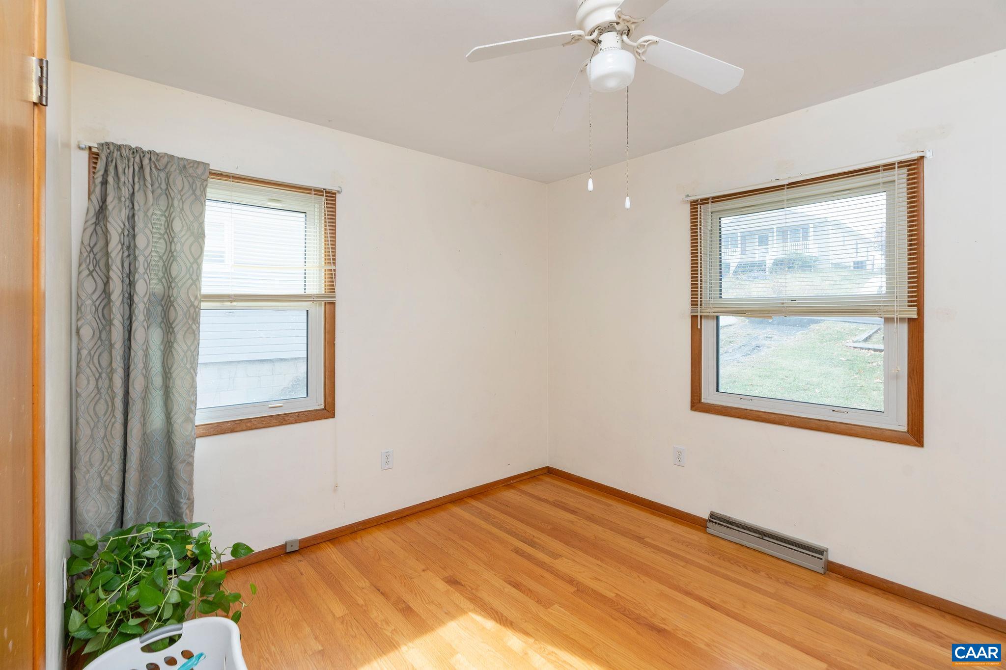 609 B Street Staunton, VA 24401 - Photo 15 of 33 a view of an empty room with wooden floor and a window