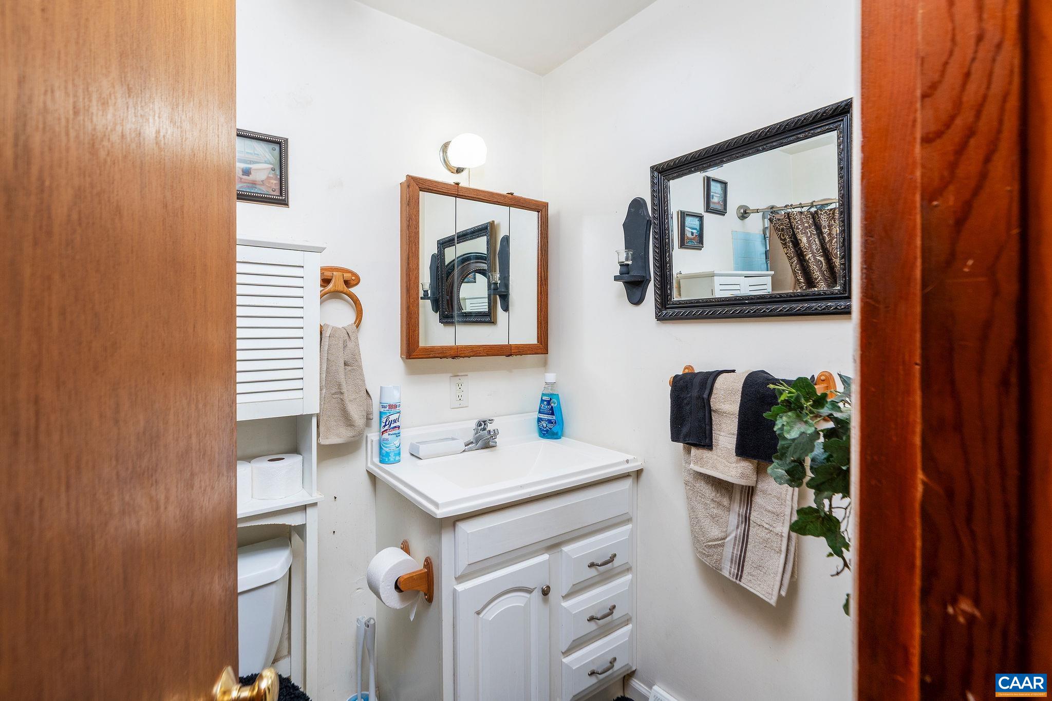 609 B Street Staunton, VA 24401 - Photo 19 of 33 a bathroom with a sink and a mirror