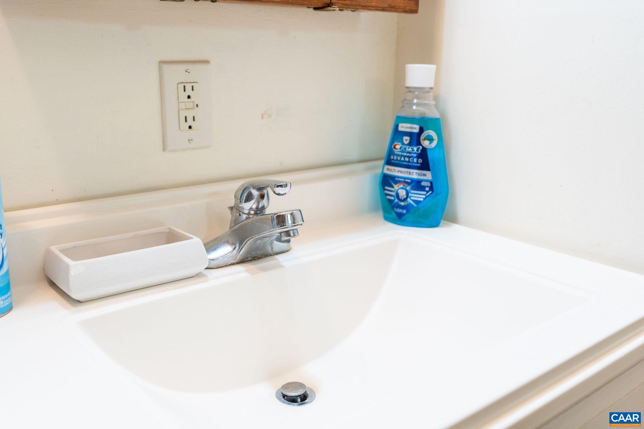 609 B Street Staunton, VA 24401 - Photo 20 of 33 a bathroom with a sink and a shower curtain