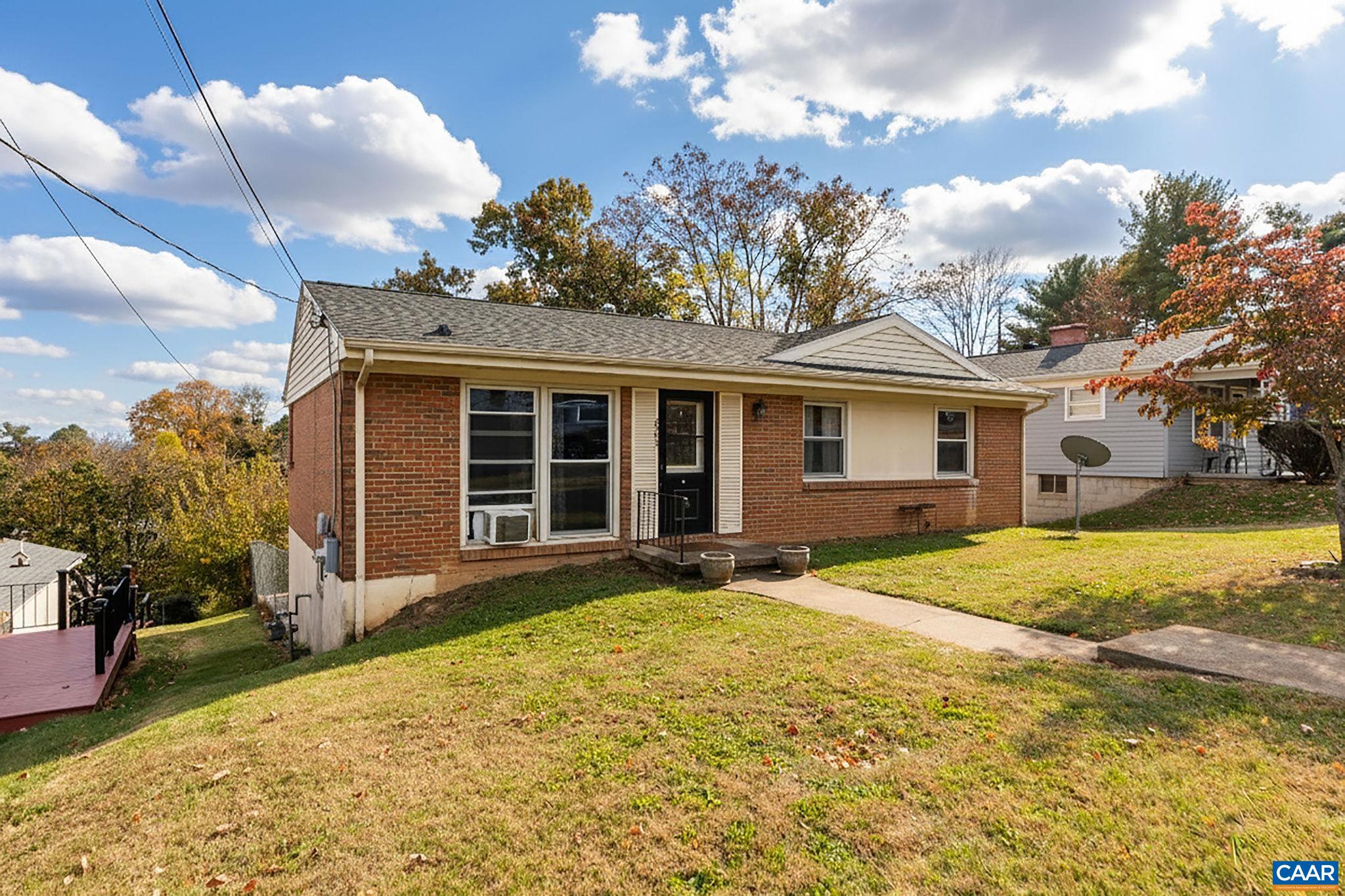 609 B Street Staunton, VA 24401 - Photo 2 of 33 a front view of a house with a garden and yard