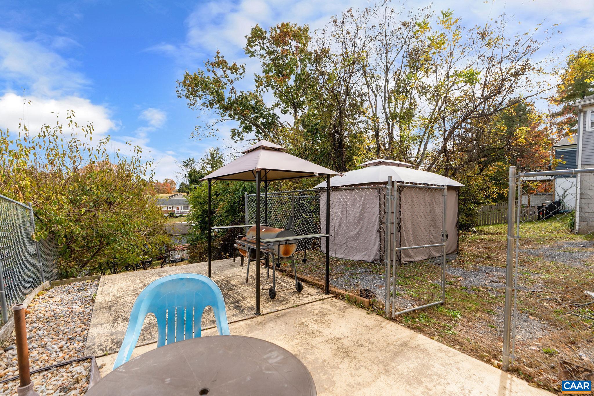 609 B Street Staunton, VA 24401 - Photo 30 of 33 a view of a table and chairs under an umbrella