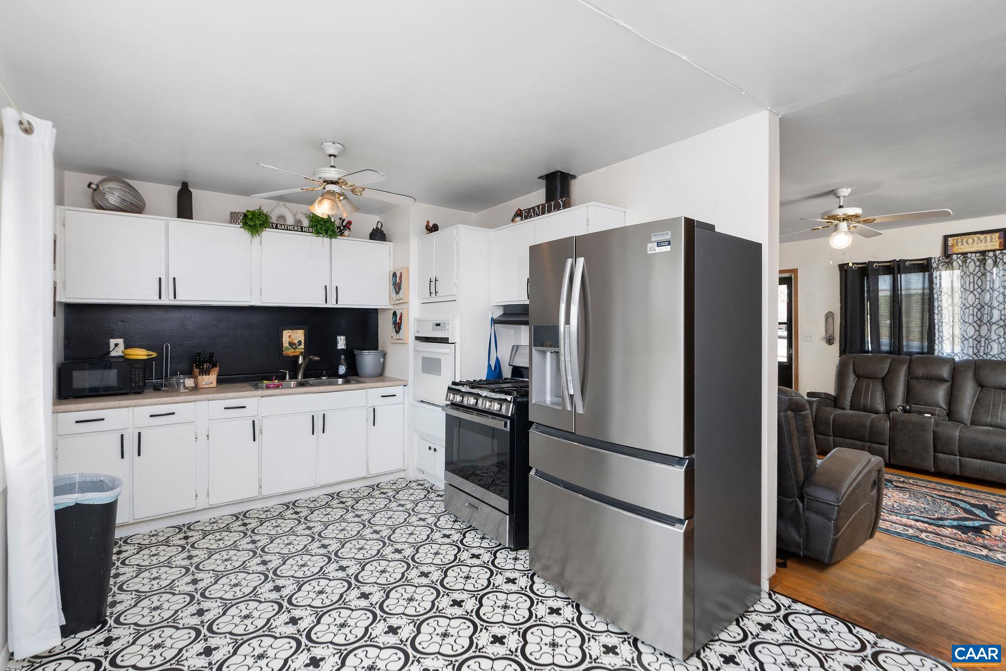 609 B Street Staunton, VA 24401 - Photo 7 of 33 a kitchen with stainless steel appliances granite countertop a refrigerator and a stove top oven