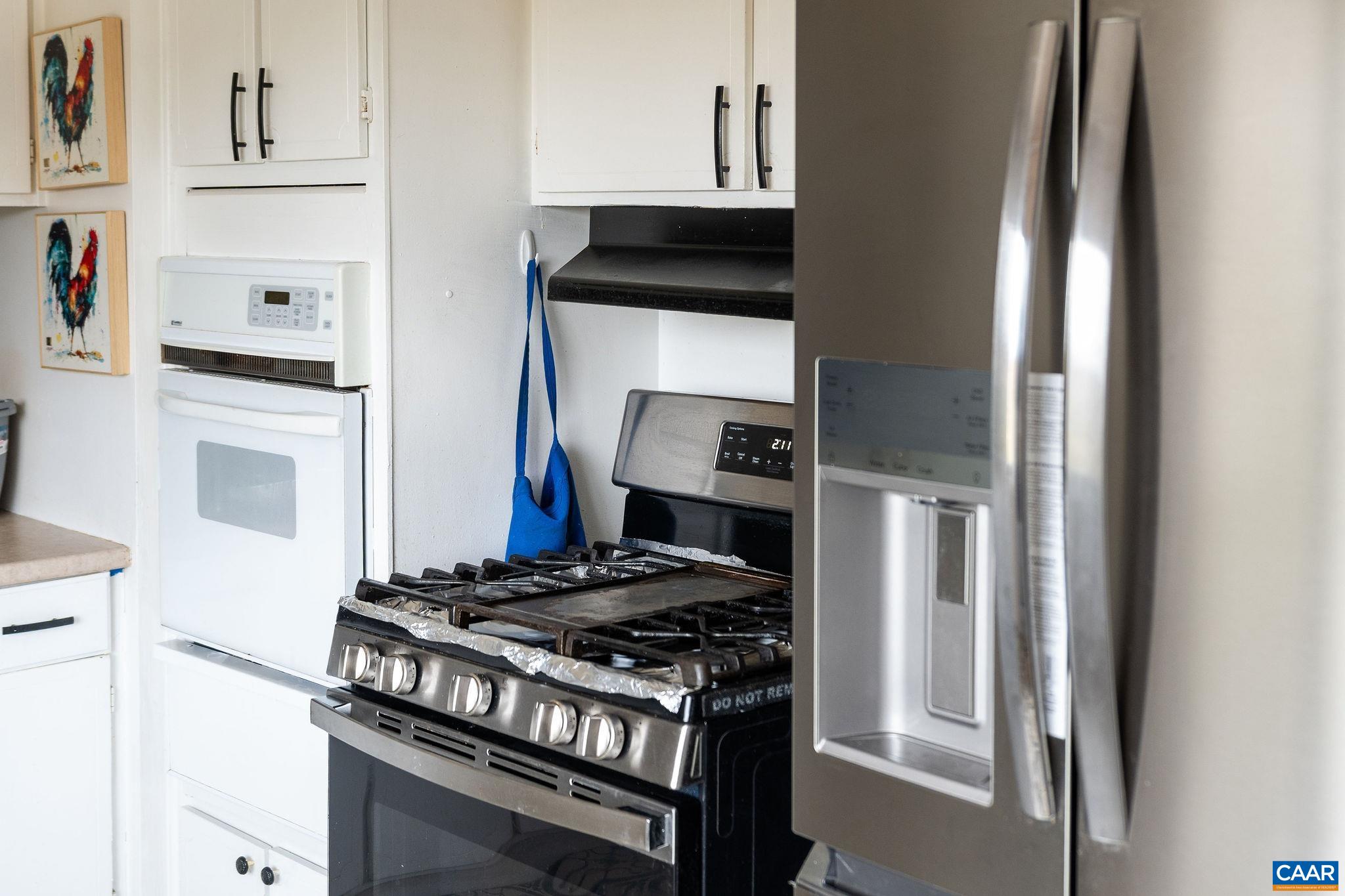 609 B Street Staunton, VA 24401 - Photo 8 of 33 a kitchen with stainless steel appliances granite countertop a stove and a refrigerator