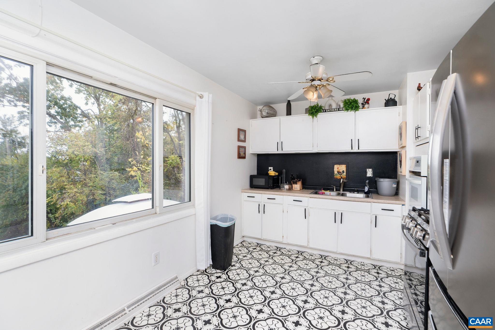 609 B Street Staunton, VA 24401 - Photo 10 of 33 a kitchen with stainless steel appliances a refrigerator sink and microwave