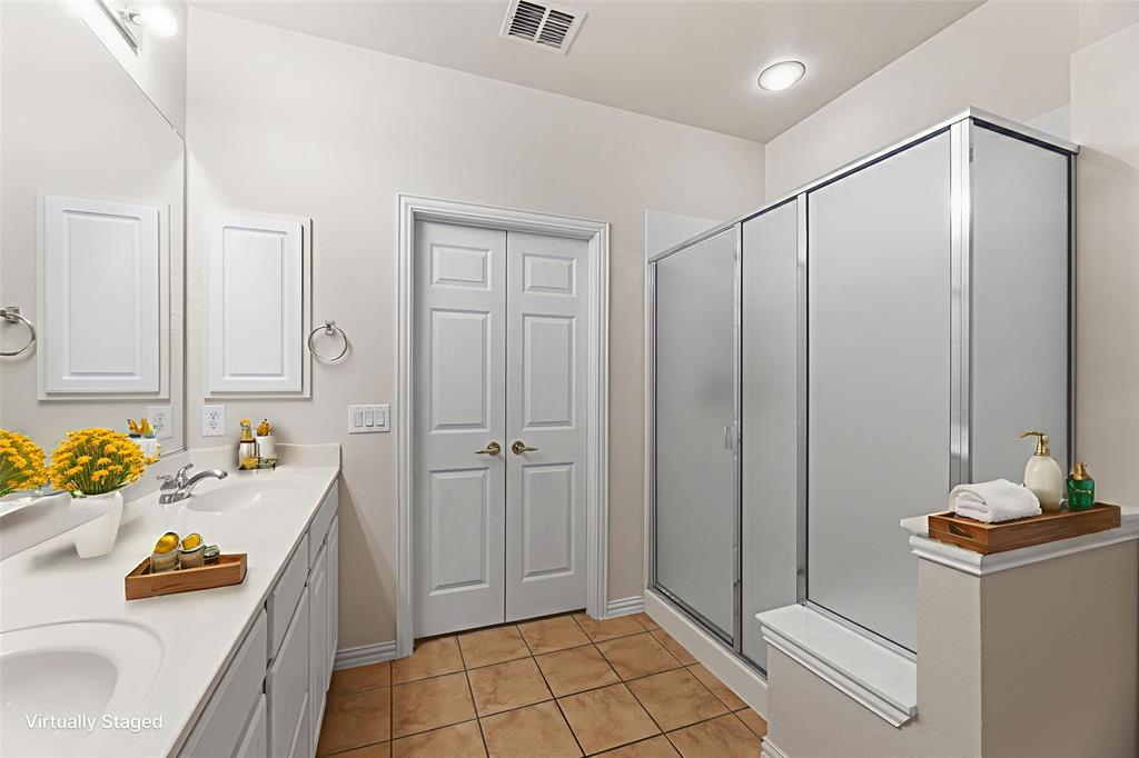 719 Scenic Ranch Circle Fairview, TX 75069 - Photo 23 of 36 a bathroom with a sink and a mirror