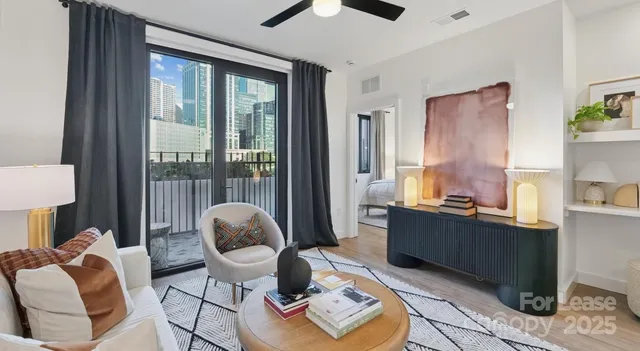 a living room with furniture and a large window