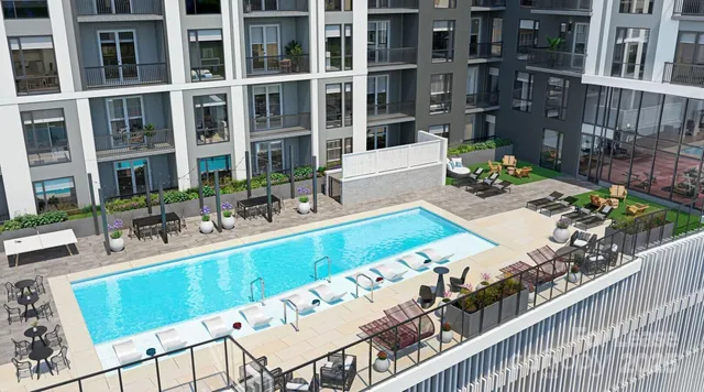 a view of swimming pool with outdoor seating