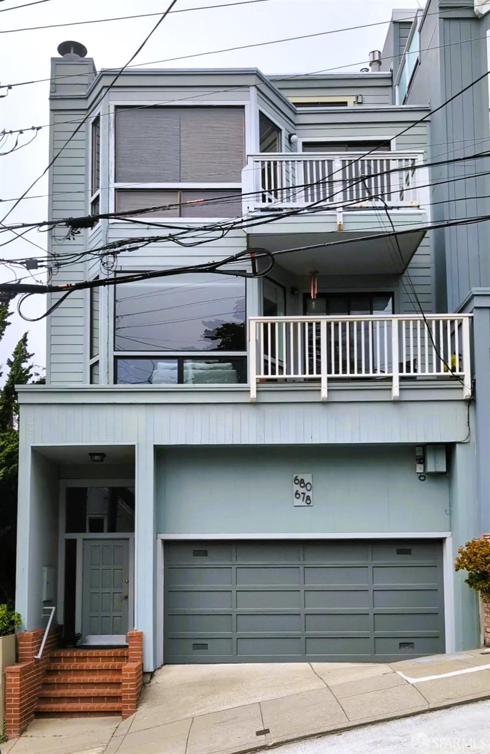 front view of a house with a balcony