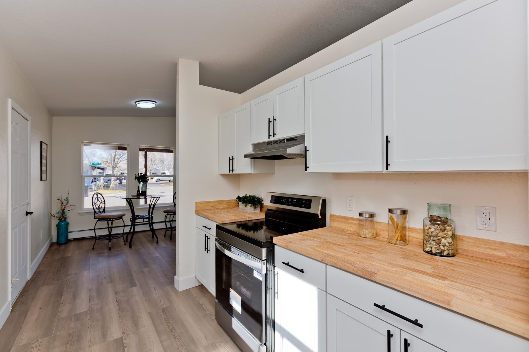 634 1/2 Colony Road Clifton, CO 81520 - Photo 14 of 42 a kitchen with stainless steel appliances granite countertop a stove a sink and a refrigerator