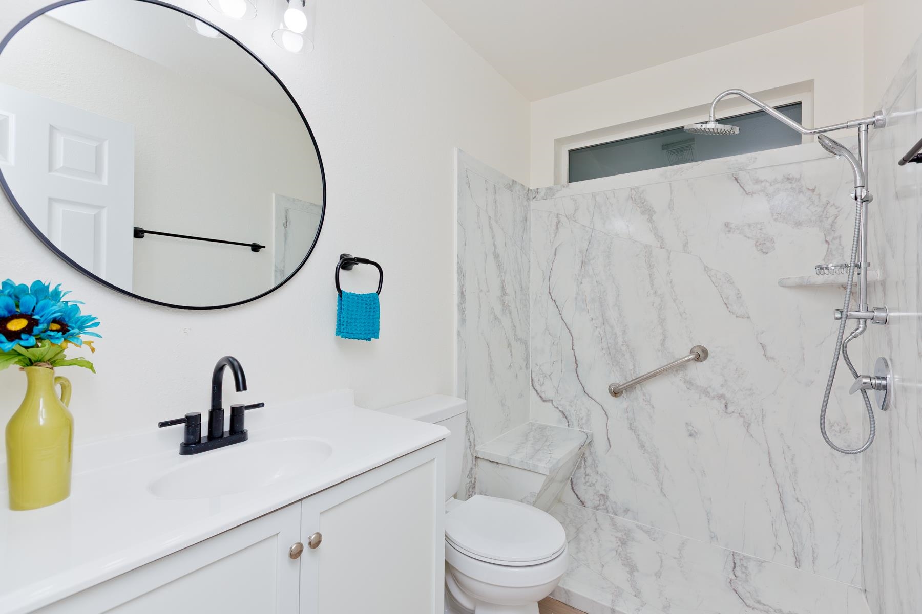 634 1/2 Colony Road Clifton, CO 81520 - Photo 20 of 42 a bathroom with a sink vanity mirror and toilet