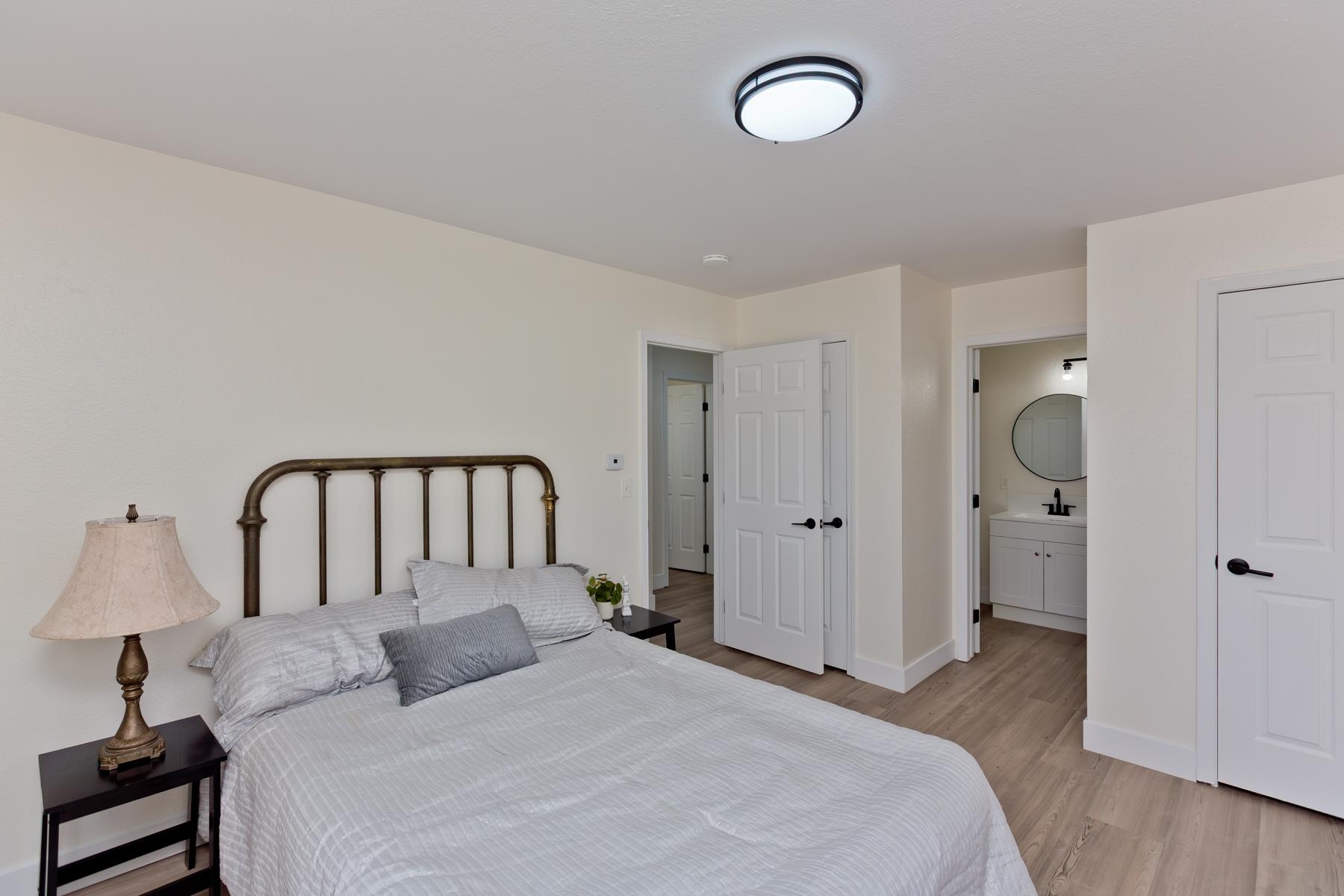 634 1/2 Colony Road Clifton, CO 81520 - Photo 26 of 42 a bedroom with a bed and a lamp