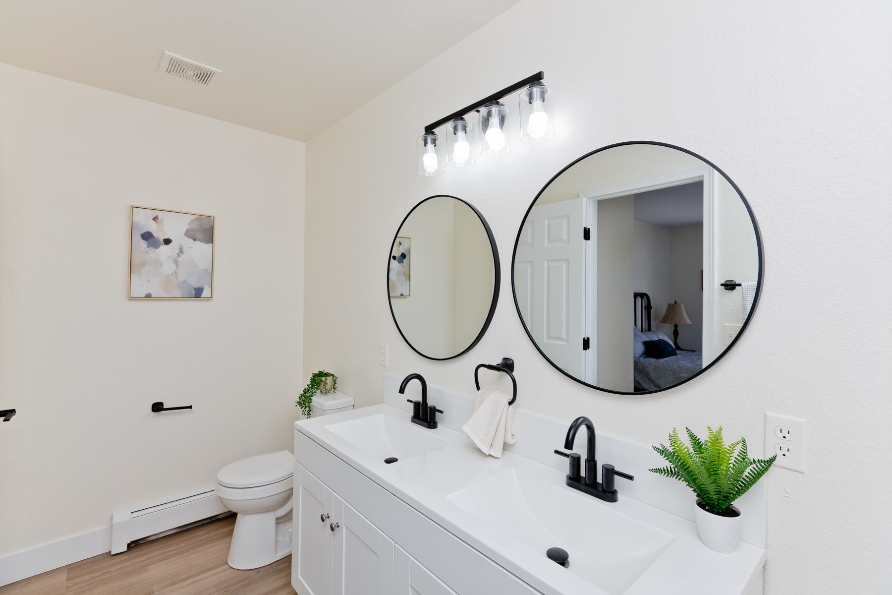634 1/2 Colony Road Clifton, CO 81520 - Photo 30 of 42 a bathroom with a toilet a sink and a mirror