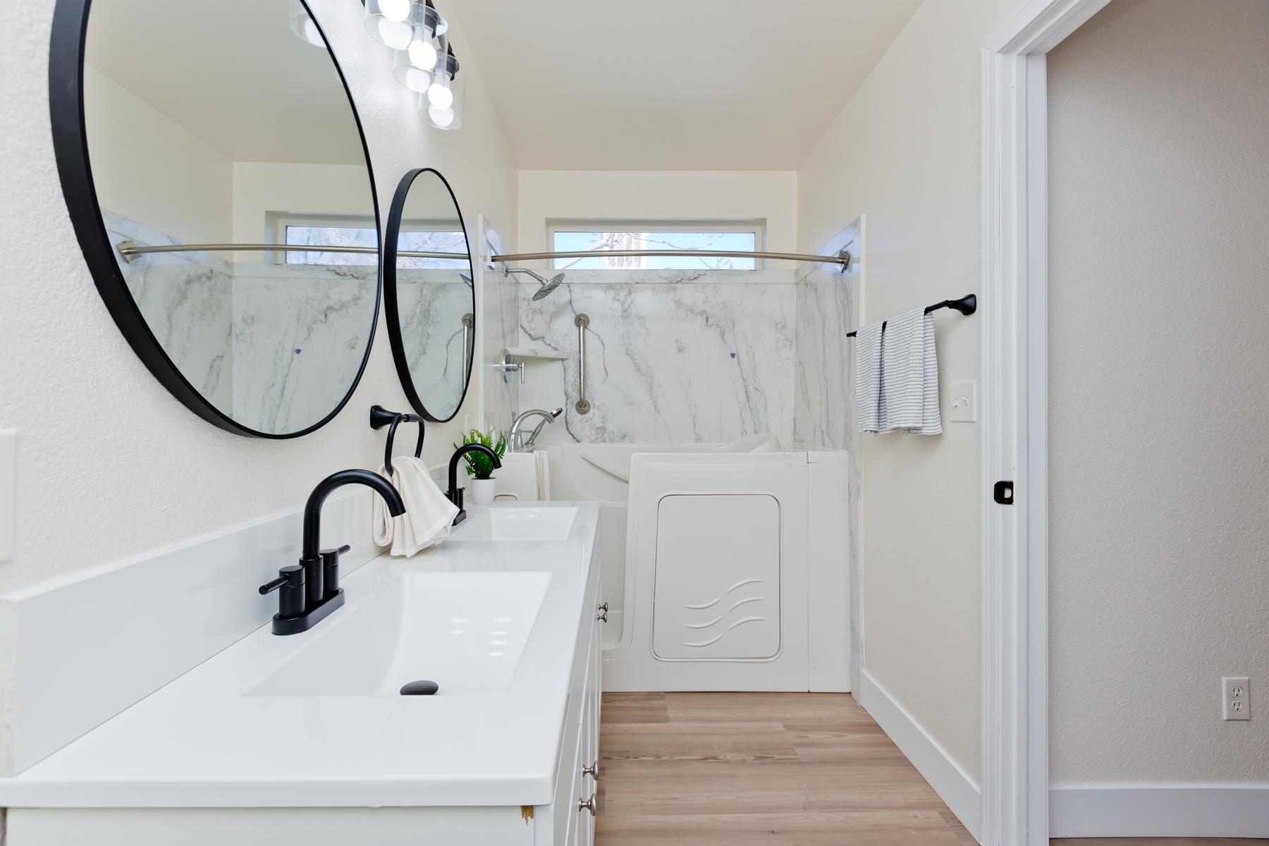 634 1/2 Colony Road Clifton, CO 81520 - Photo 31 of 42 a bathroom with a sink a mirror and a shower