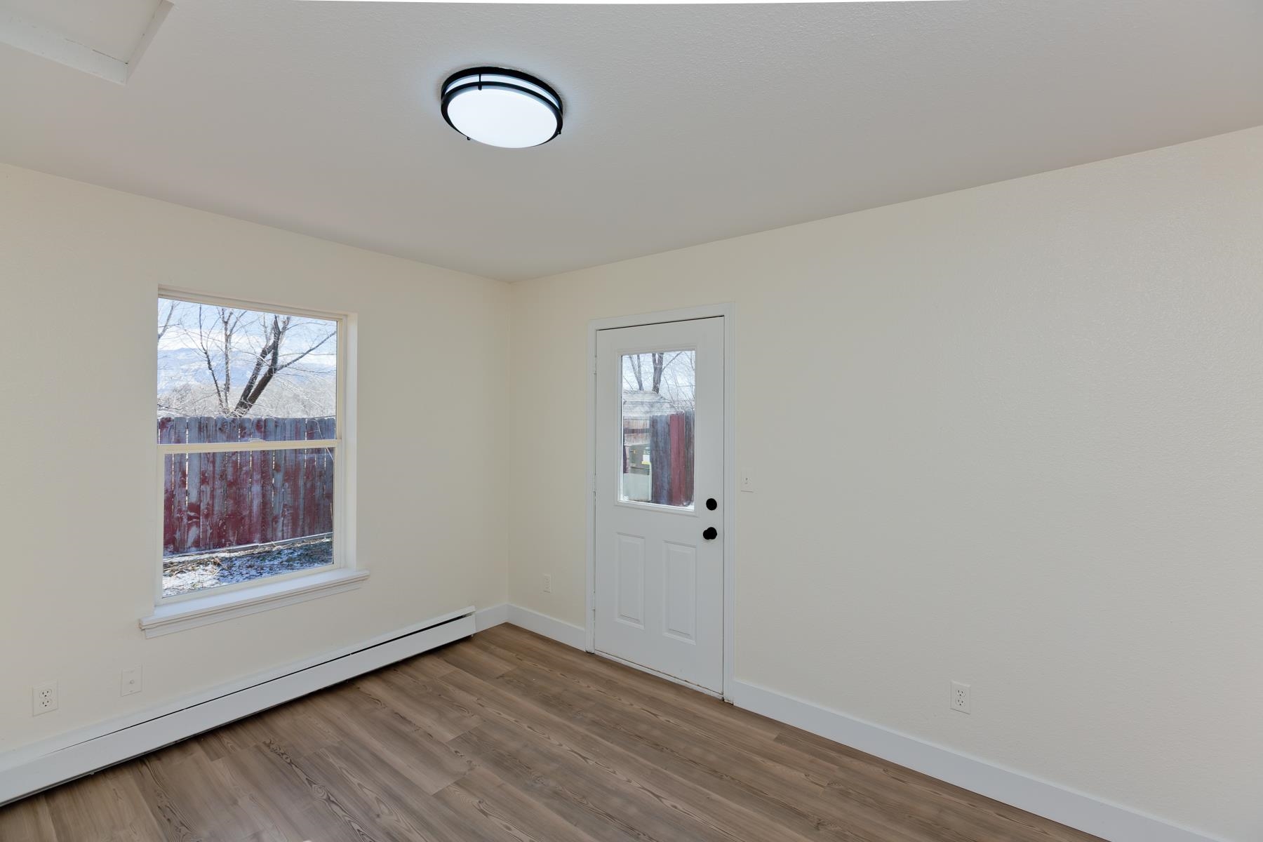 634 1/2 Colony Road Clifton, CO 81520 - Photo 33 of 42 a view of a room with wooden floor and window