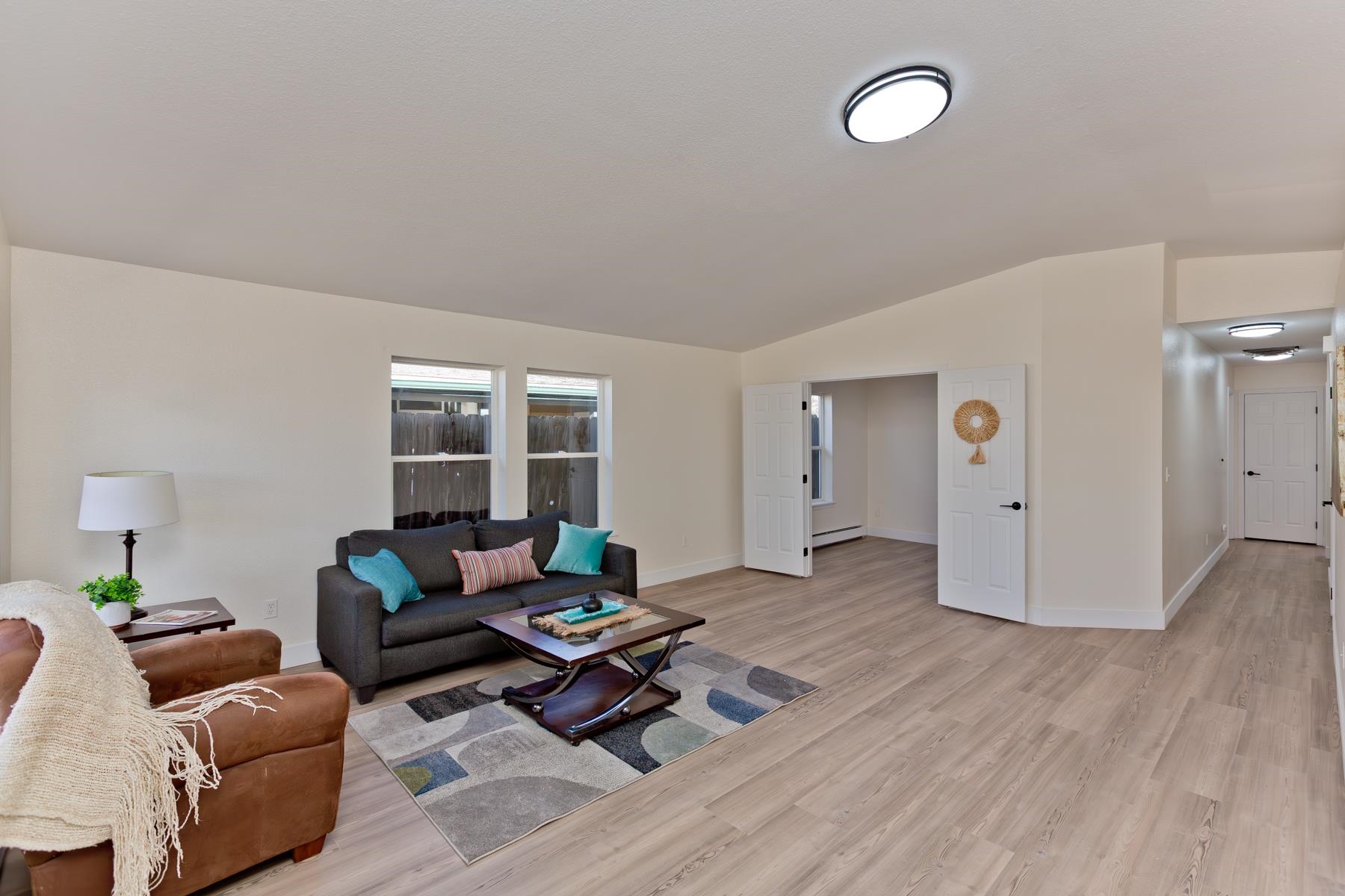 634 1/2 Colony Road Clifton, CO 81520 - Photo 7 of 42 a living room with furniture and a table