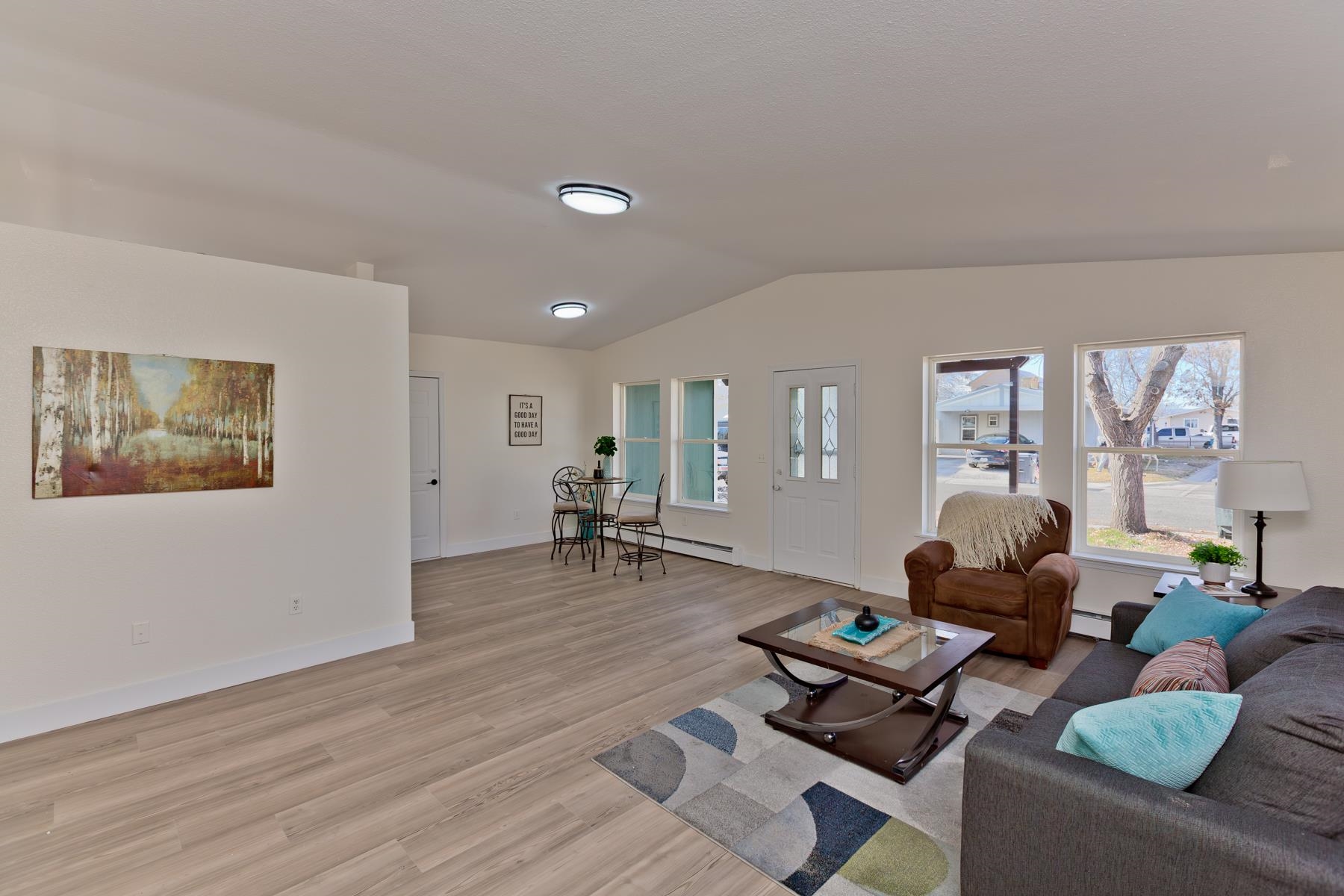 634 1/2 Colony Road Clifton, CO 81520 - Photo 9 of 42 a living room with furniture and wooden floor