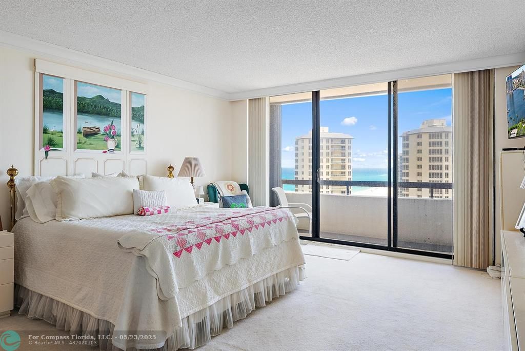 4100 North Ocean Drive, Unit 1804 Riviera Beach, FL 33404 - Photo 15 of 30 a bedroom with a large bed and a large window