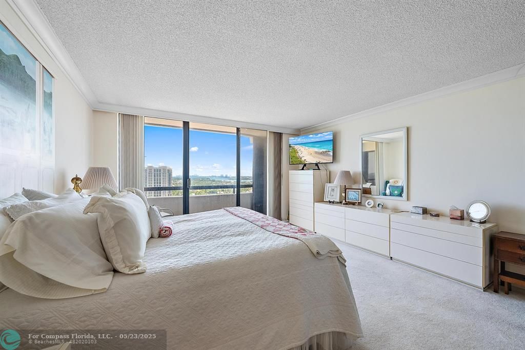 4100 North Ocean Drive, Unit 1804 Riviera Beach, FL 33404 - Photo 16 of 30 a large white bed in a white room