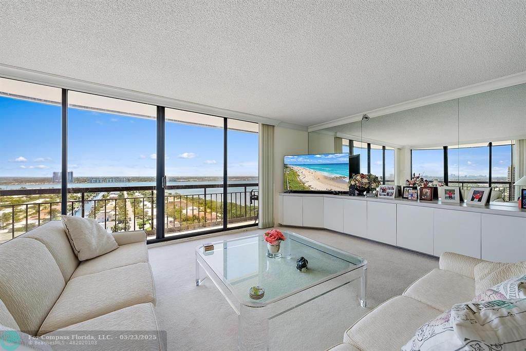 4100 North Ocean Drive, Unit 1804 Riviera Beach, FL 33404 - Photo 4 of 30 a living room with furniture and a large window