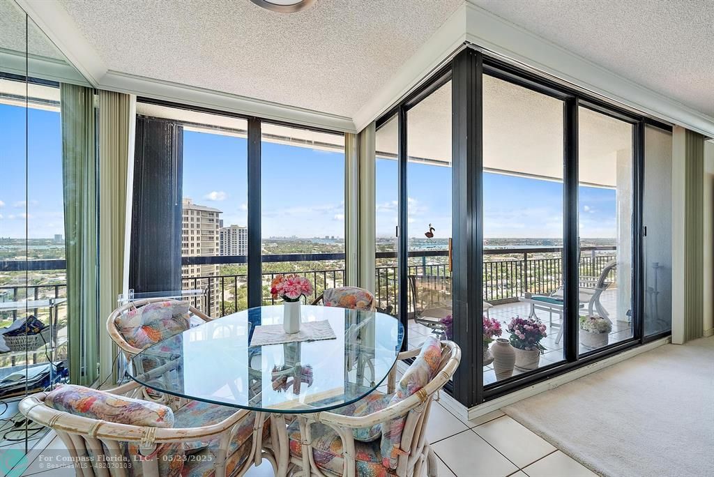 4100 North Ocean Drive, Unit 1804 Riviera Beach, FL 33404 - Photo 9 of 30 a dining room with furniture and a floor to ceiling window