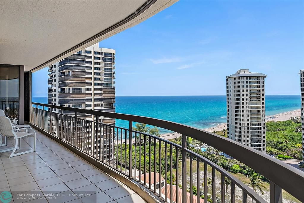 4100 North Ocean Drive, Unit 1804 Riviera Beach, FL 33404 - Photo 10 of 30 a view of balcony with floor to ceiling windows with wooden floor