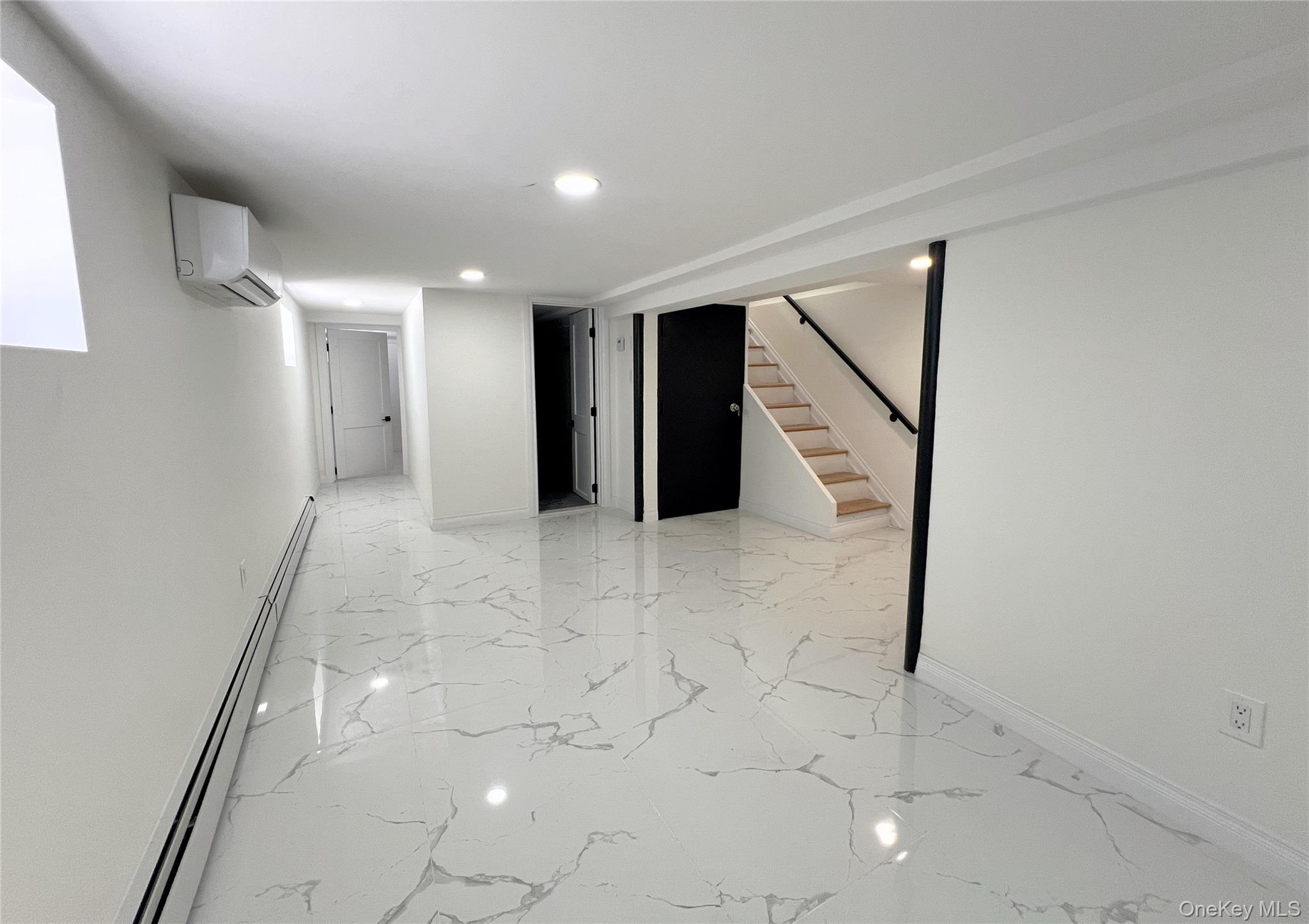 66-08 73rd Place Queens, NY 11379 - Photo 13 of 17 a view of hallway with stairs