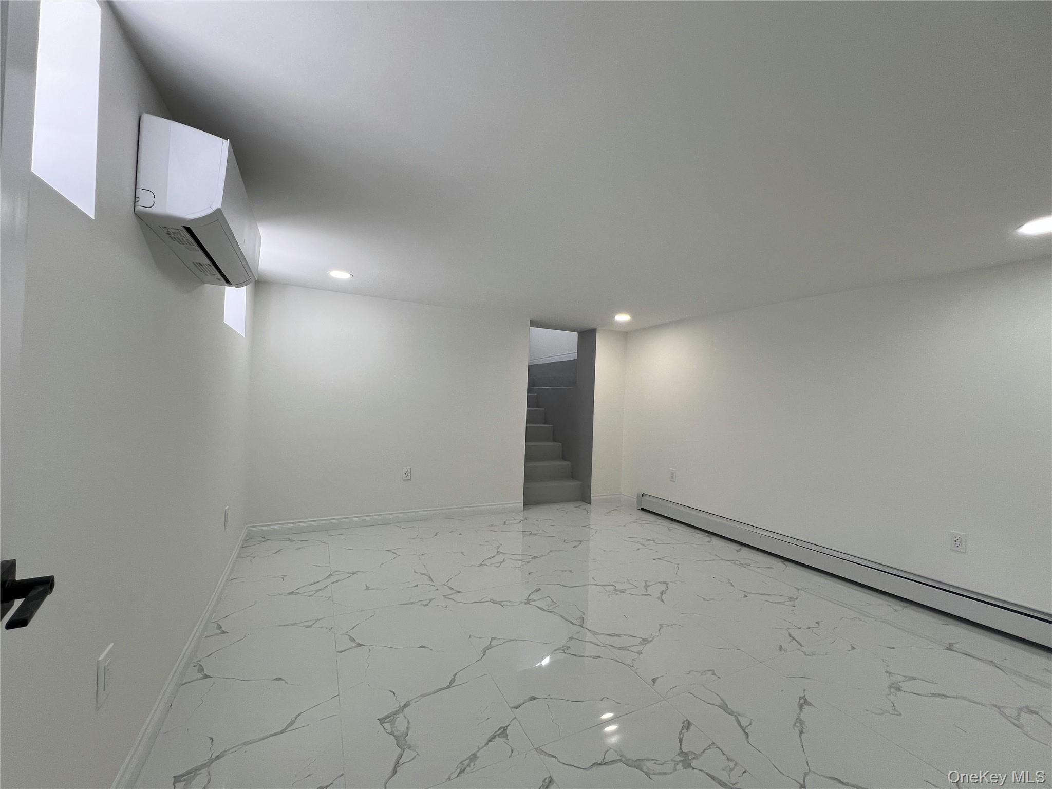 66-08 73rd Place Queens, NY 11379 - Photo 15 of 17 a view of an empty room