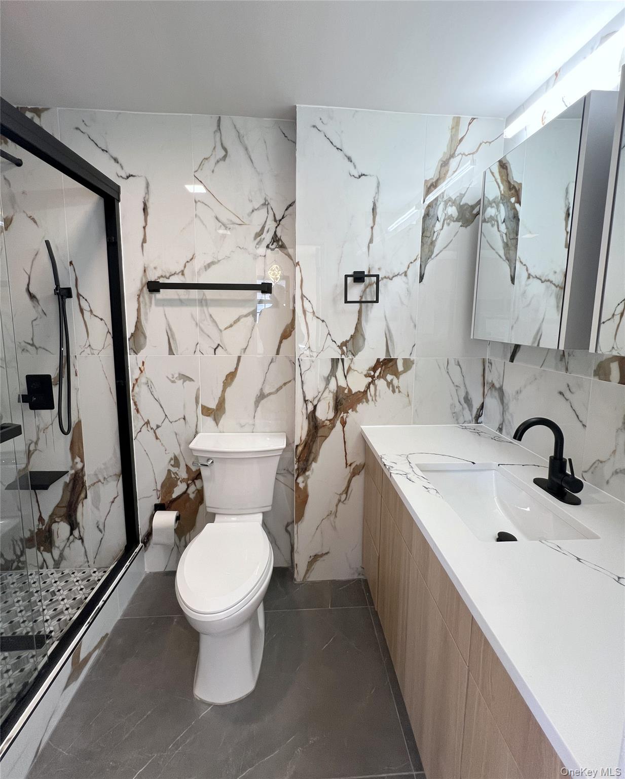 66-08 73rd Place Queens, NY 11379 - Photo 5 of 17 a bathroom with a sink toilet and shower