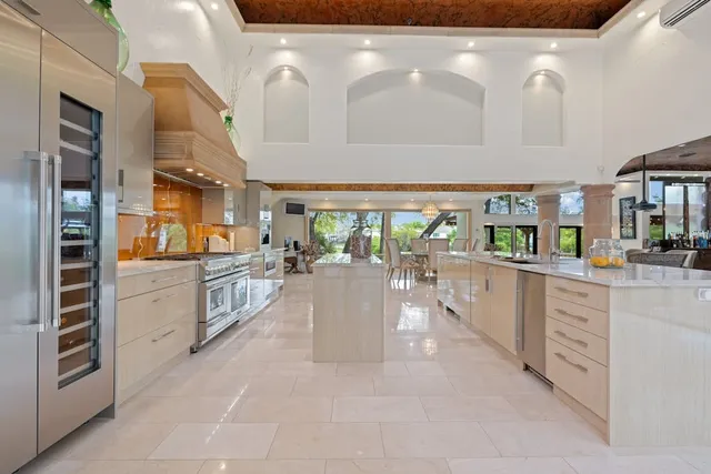 a lobby with furniture and a kitchen