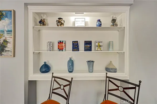 a living room with hard wood cabinets