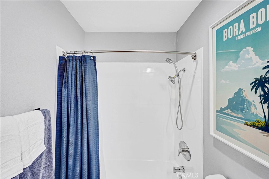 3010 Associated Road, Unit 133 Fullerton, CA 92835 - Photo 18 of 48 a bathroom with a shower and a glass door