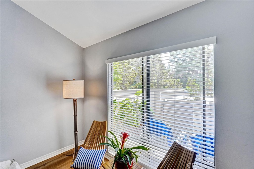 3010 Associated Road, Unit 133 Fullerton, CA 92835 - Photo 24 of 48 a view of a bedroom with furniture and wooden floor