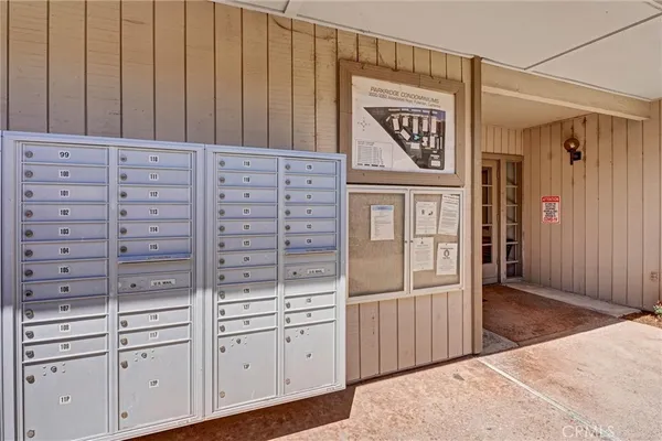 a view of a hallway with cabinets