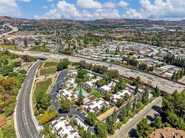 an aerial view of residential houses with outdoor space