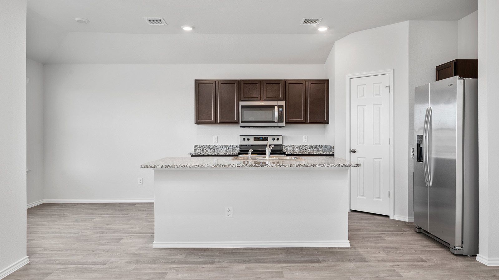 1418 Victory Rnch Trail Killeen, TX 76549 - Photo 7 of 22 A well-appointed kitchen features a large island and contemporary stainless steel appliances.