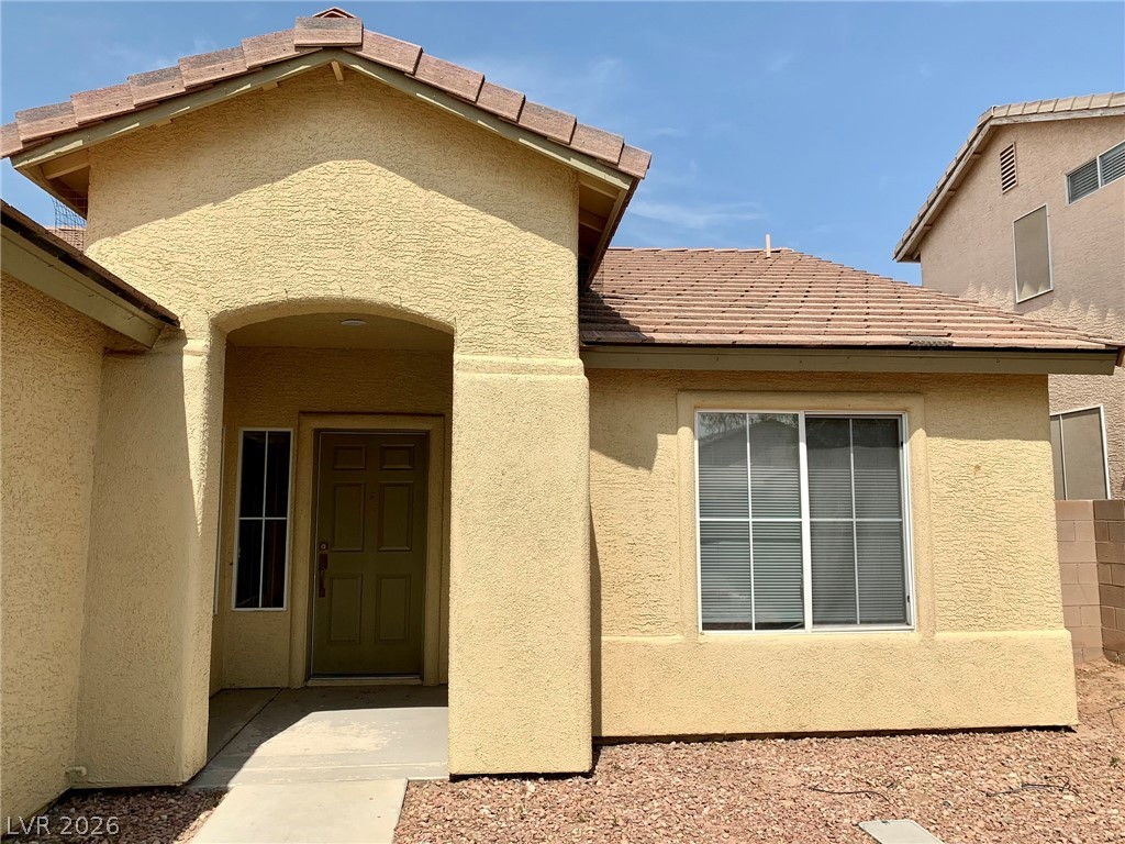 3821 Bombastic Court Las Vegas, NV 89147 - Photo 2 of 36 This charming residence features an inviting entry, perfect for welcoming guests.