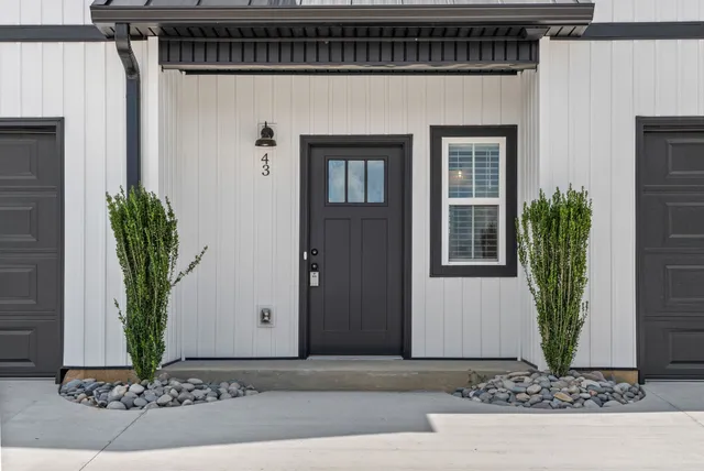 a front view of a house with garden
