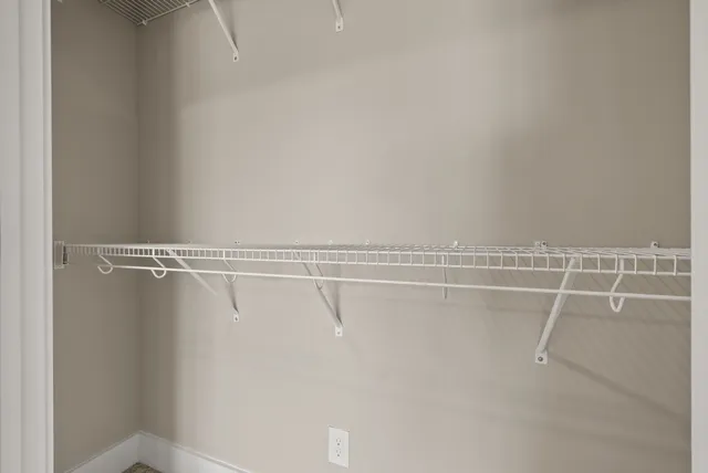 a view of a room with racks on the wall