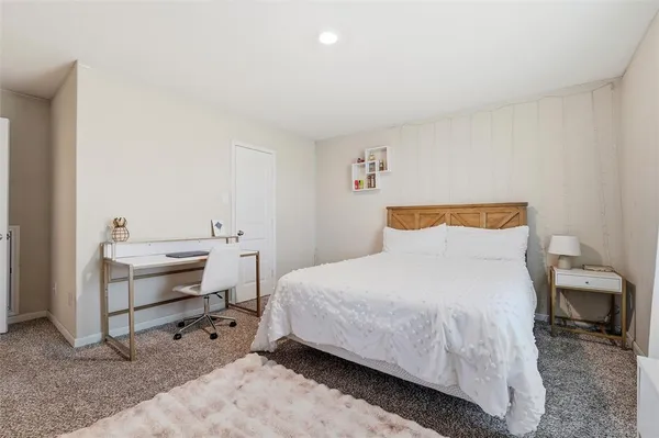 a bedroom with a bed and white walls