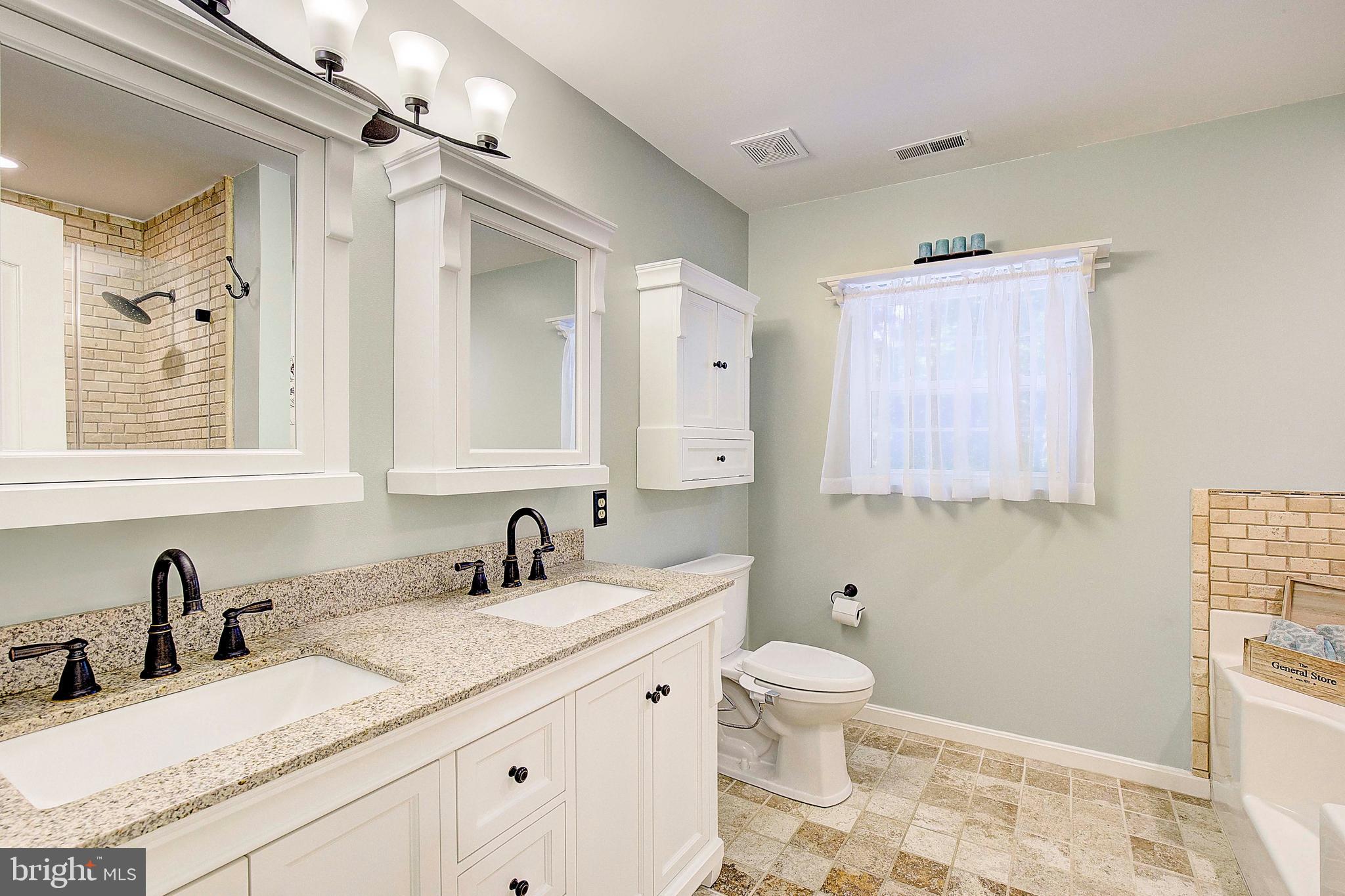 205 Walnut Creek Road Huntingtown, MD 20639 - Photo 39 of 48 a bathroom with a granite countertop sink a toilet and a mirror