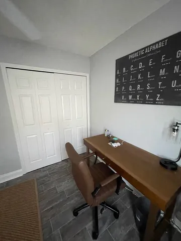 a view of a workspace with furniture