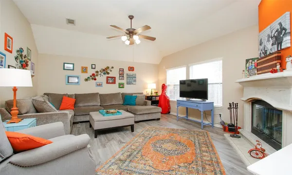a living room with furniture and a flat screen tv