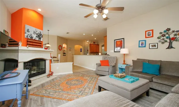 a living room with furniture and a fireplace