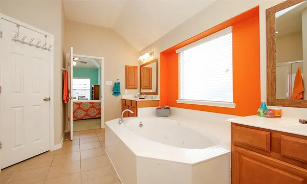 a bathroom with a bathtub and a sink